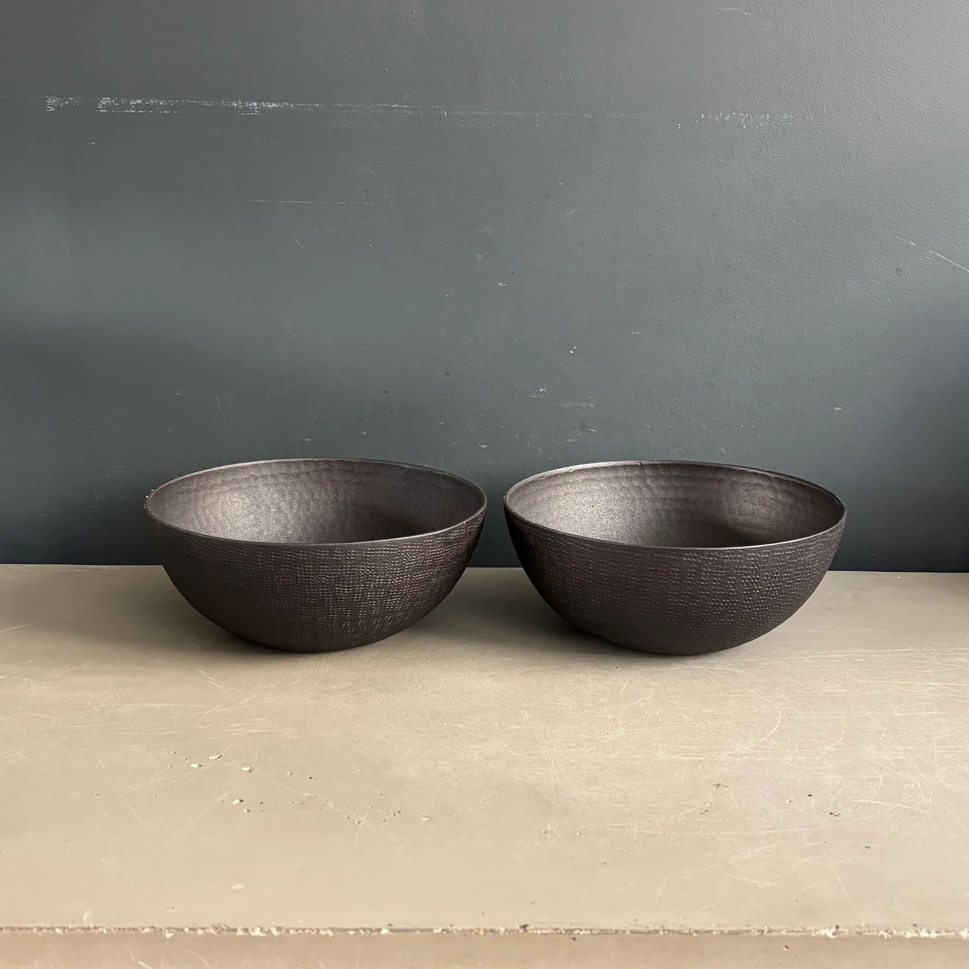 Pair of black lacquered metal catchall bowls