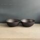 Pair of black lacquered metal catchall bowls