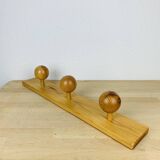 Wall coat rack with pine ball hook