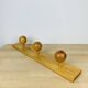 Wall coat rack with pine ball hook