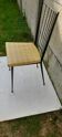 Black metal chair and yellow imitation leather seat