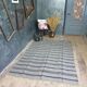 Handwoven vintage geometrical rug, grey background