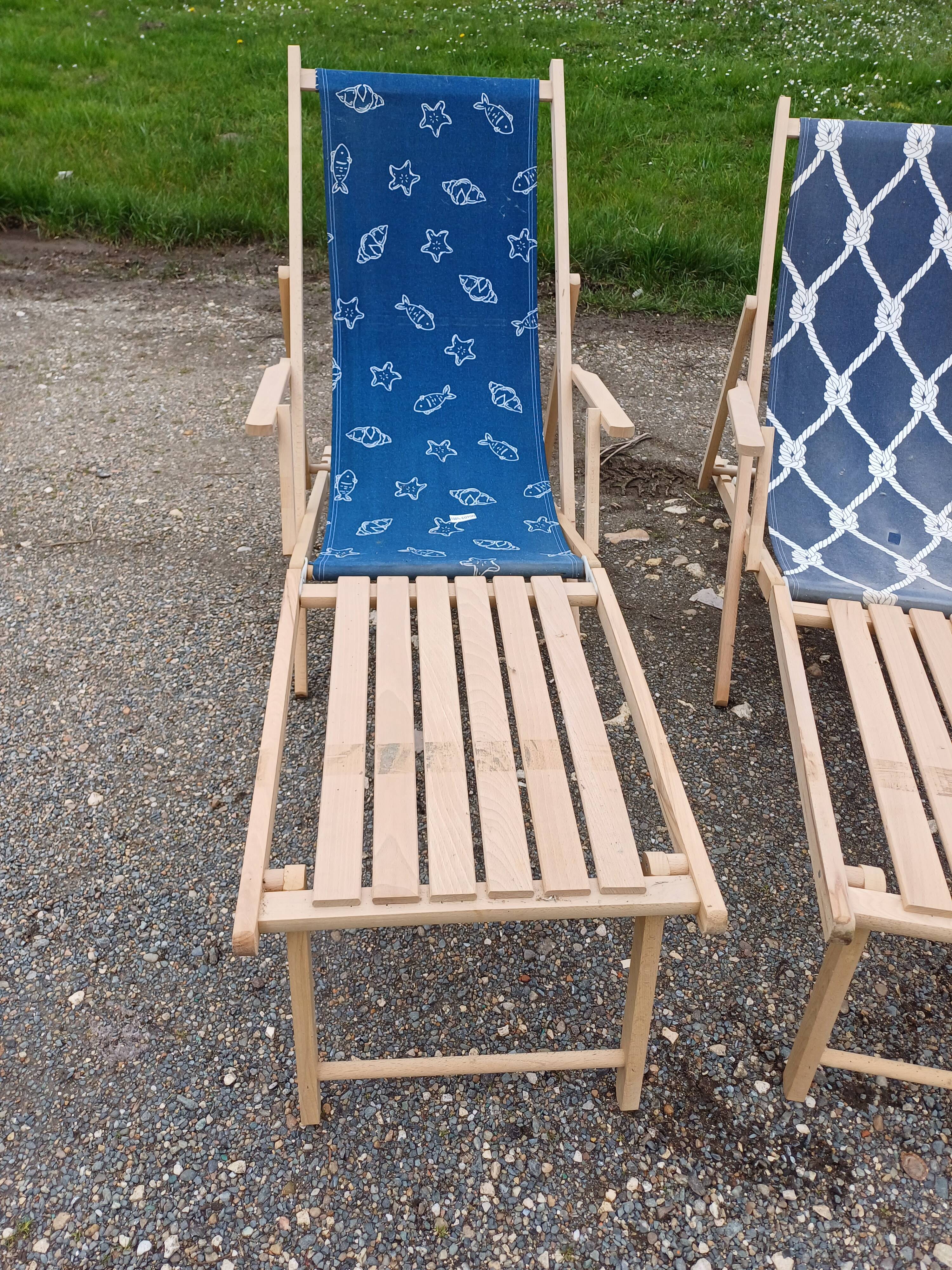 Pair of wood and fabric long chairs