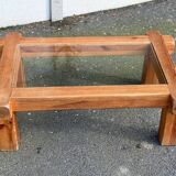 Coffee table with a glass top in Scandinavian brutalist style made of pine.