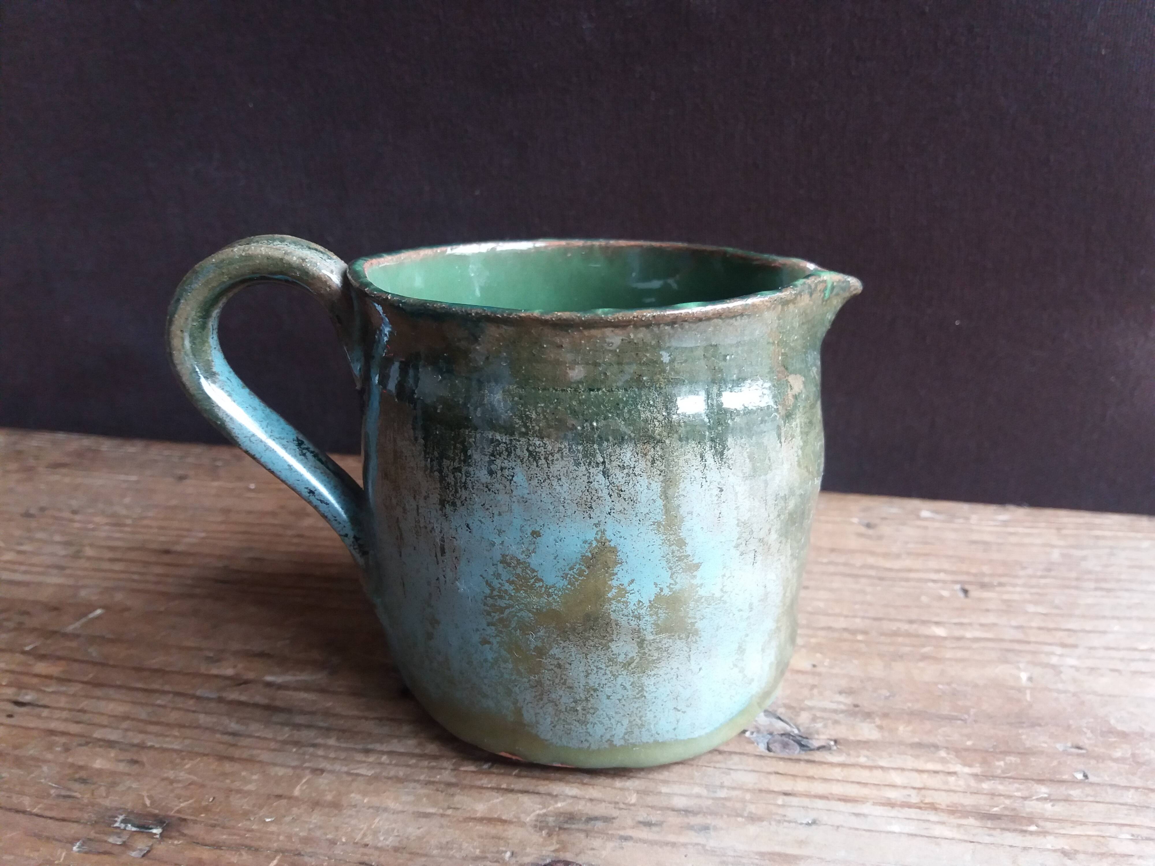 Handcrafted enameled terracotta pitcher signed