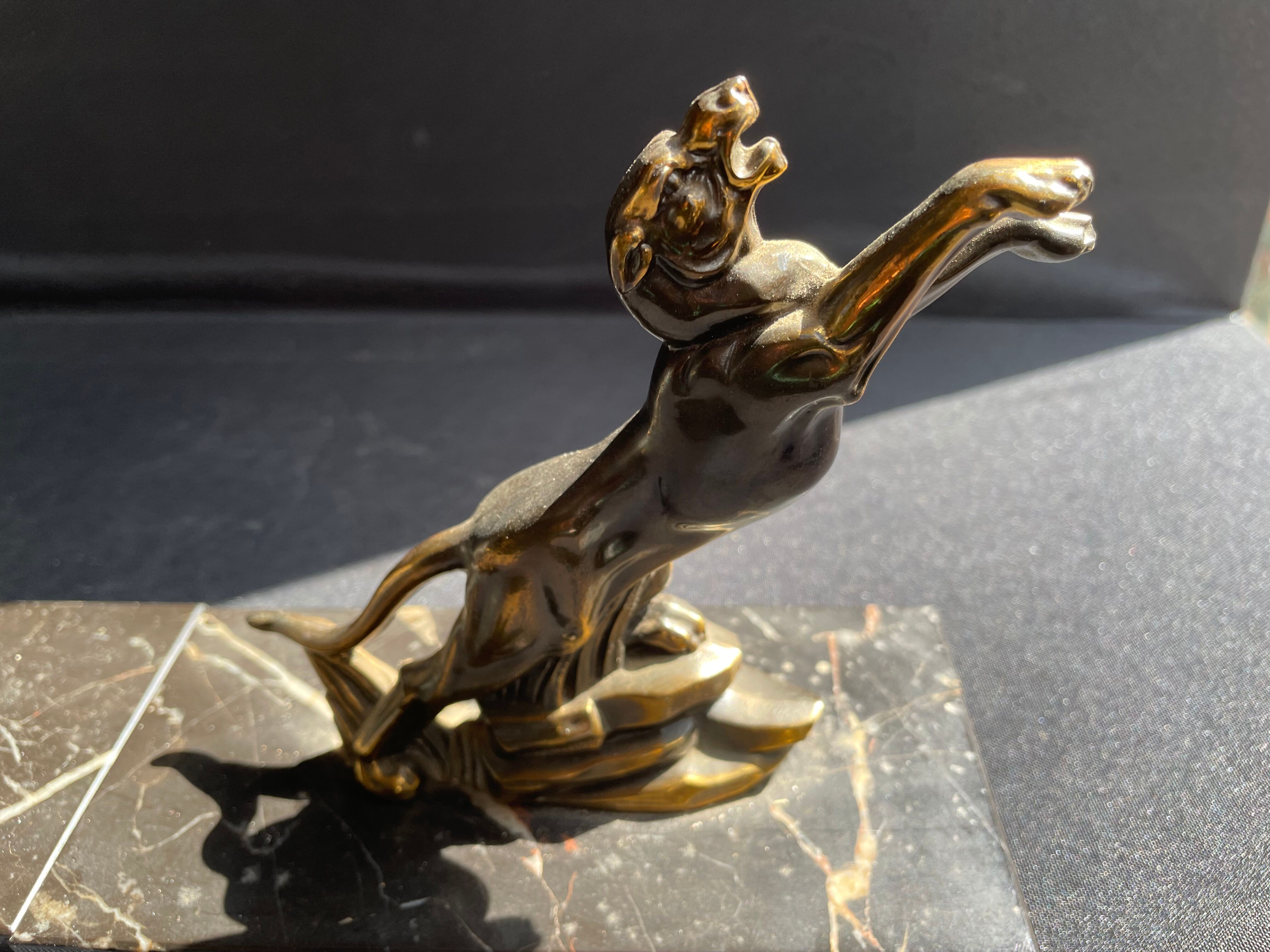 Pair of art deco marble and patinated regulated bookends