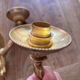 Pair of bronze wall sconces with outstretched arms and hands