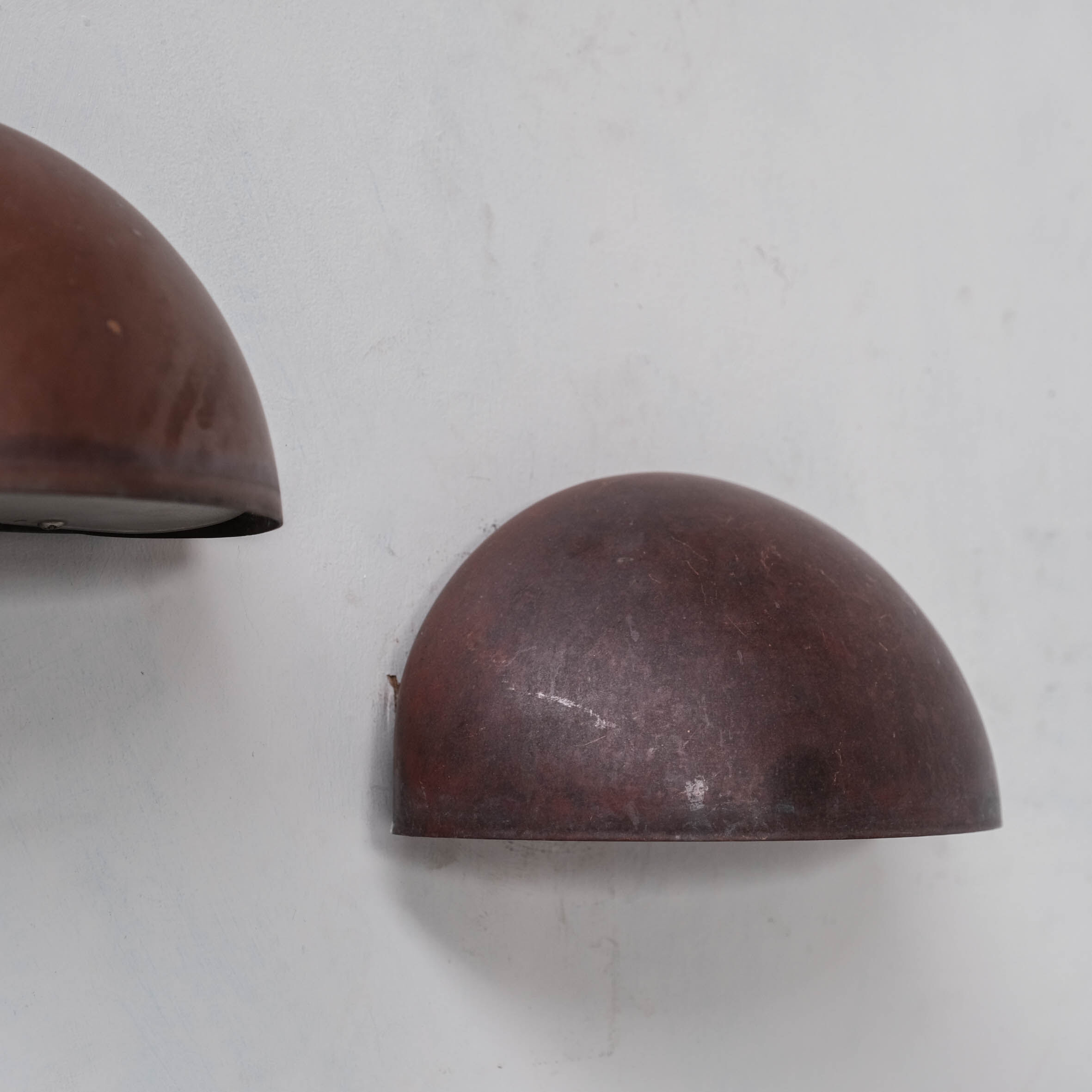 Pair of danish copper patinated wall lights