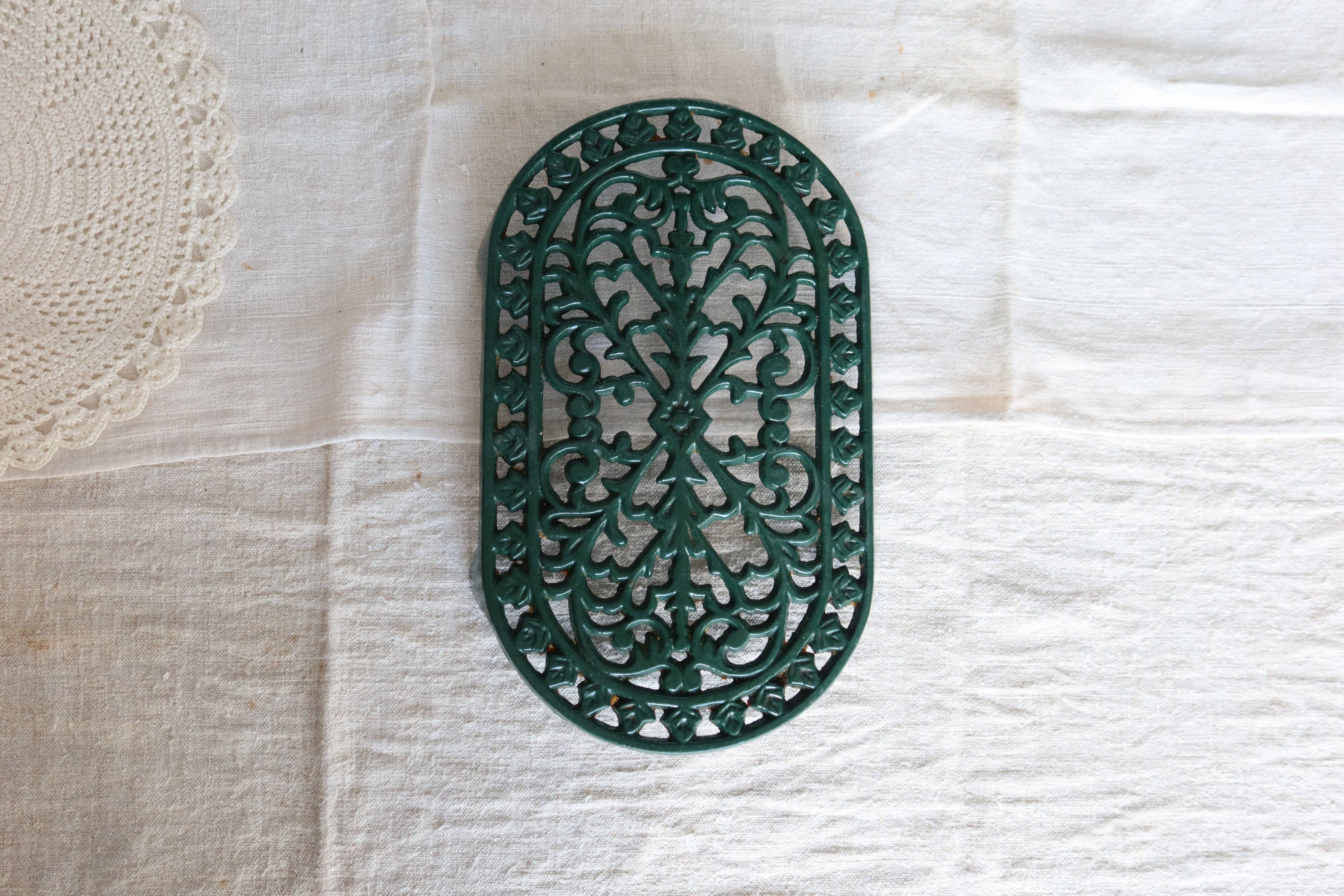 Vintage dark green cast iron oval trivet - Openwork design