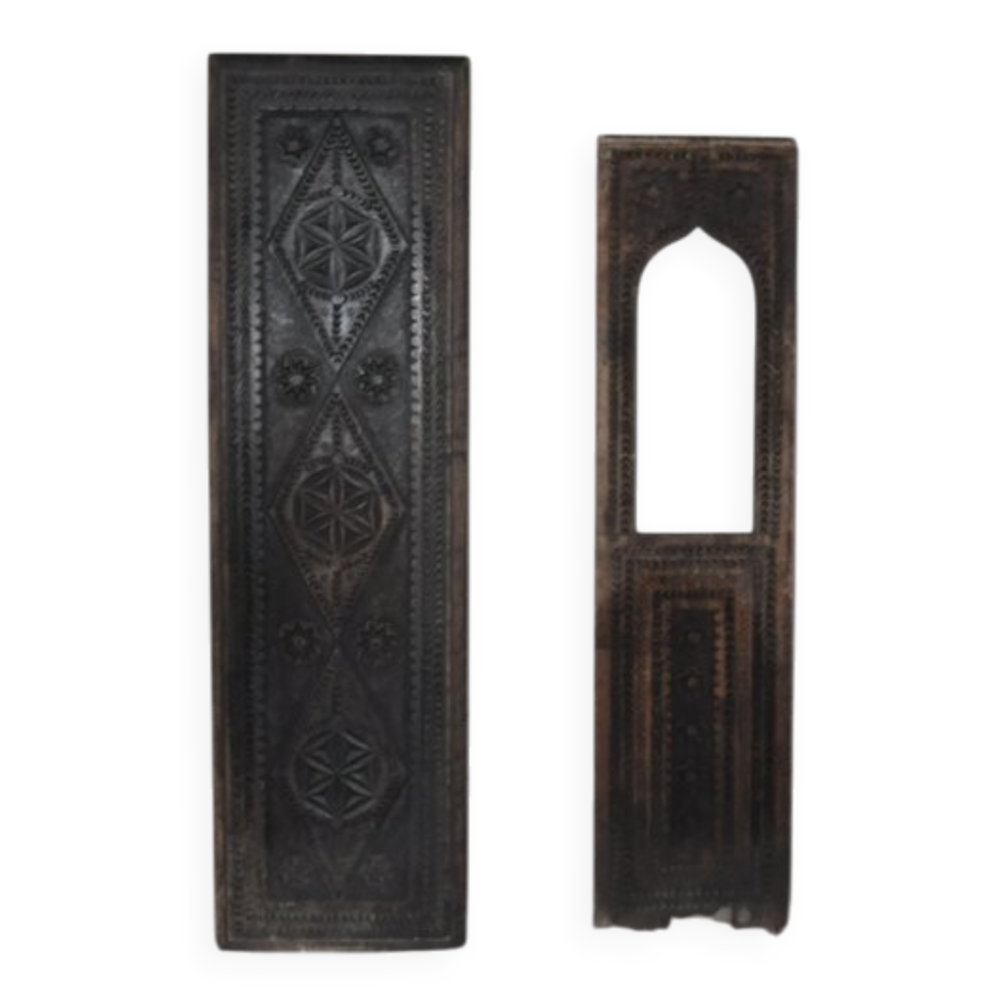 Set of 2 carved brown wooden panels, rural Hungary, 1940s, geometric patterns.