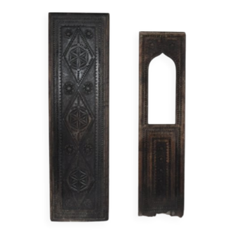 Set of 2 carved brown wooden panels, rural Hungary, 1940s, geometric patterns.