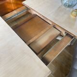 Oval table with integrated extension