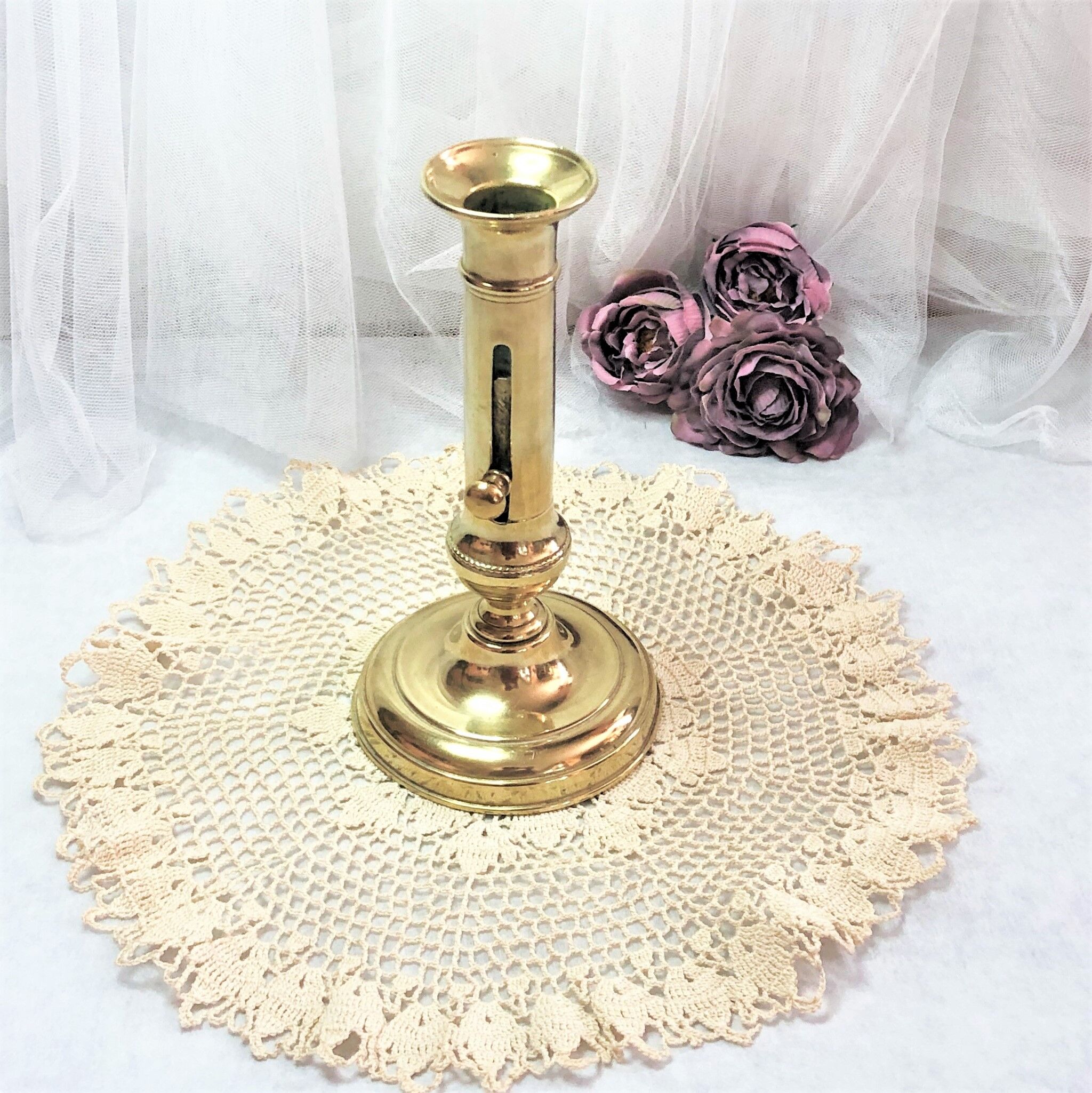 Gilded copper push candle holder