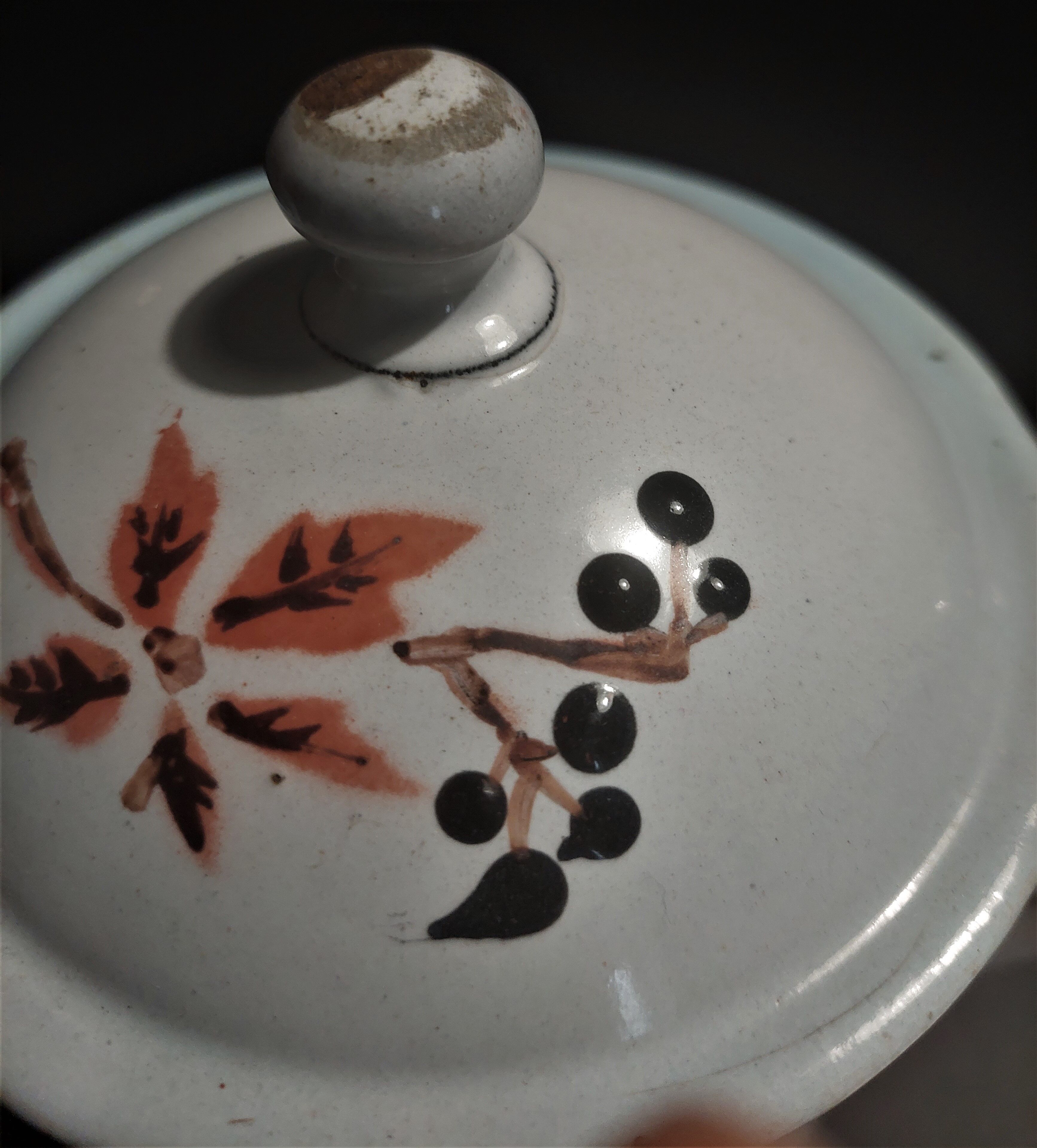 Enamelled sheet metal pourer decorated with black berries early twentieth century