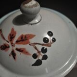 Enamelled sheet metal pourer decorated with black berries early twentieth century