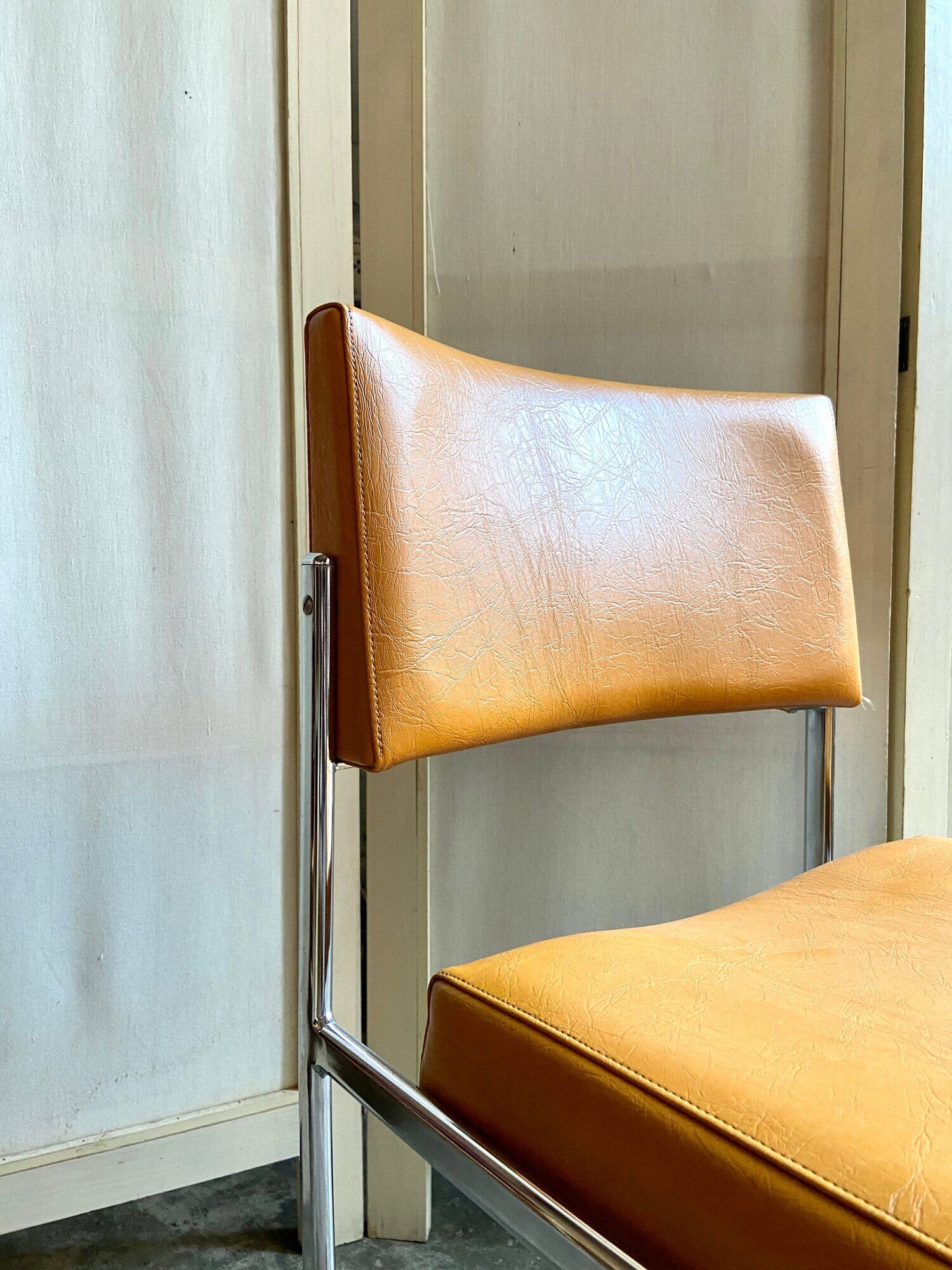 Chair in chromed metal and ochre skaï 1970s