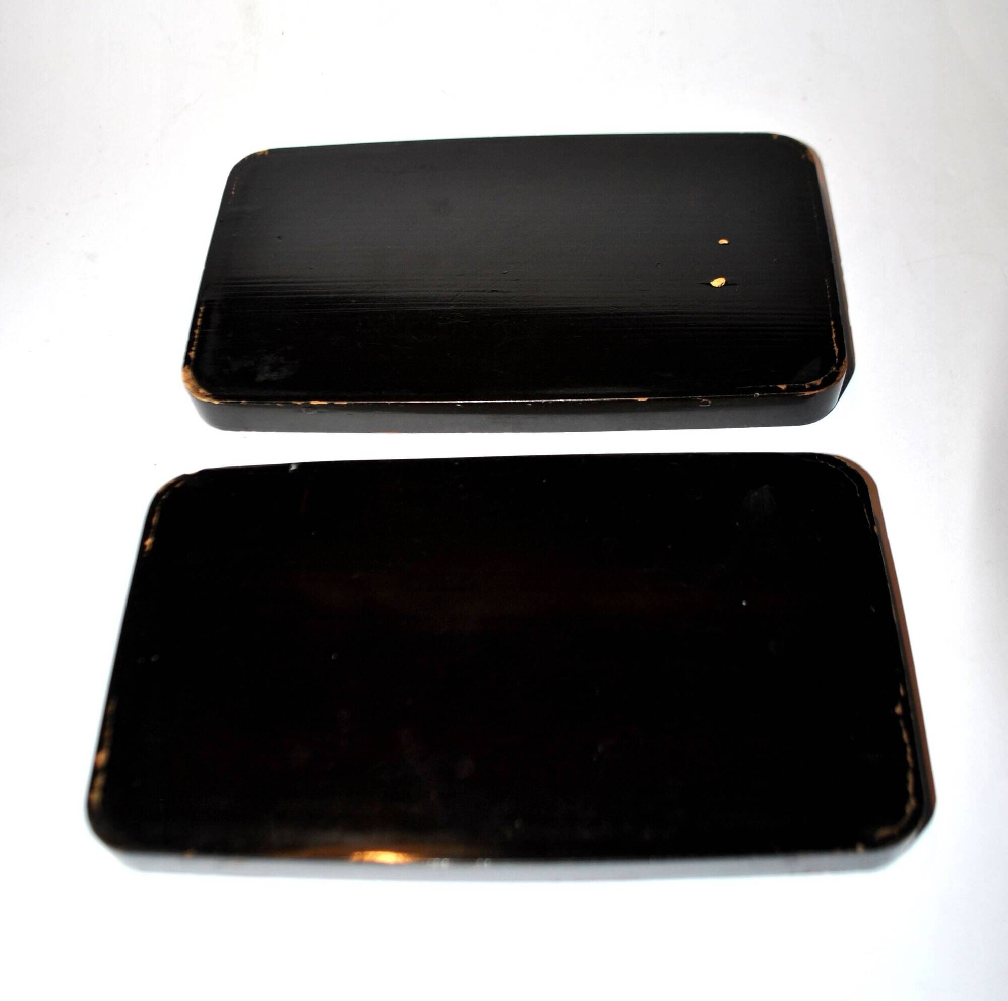 Set of two brown and black Chinese lacquer trays with bird decor