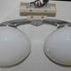 Pair of 60s wall lights in metal and opaline