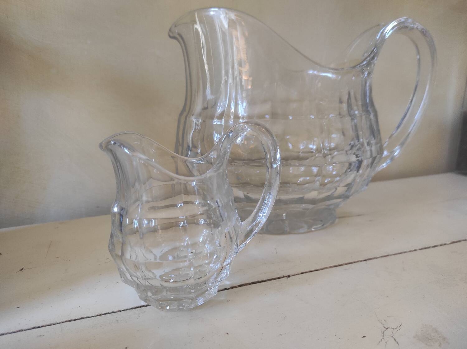 2 antique glass pitchers