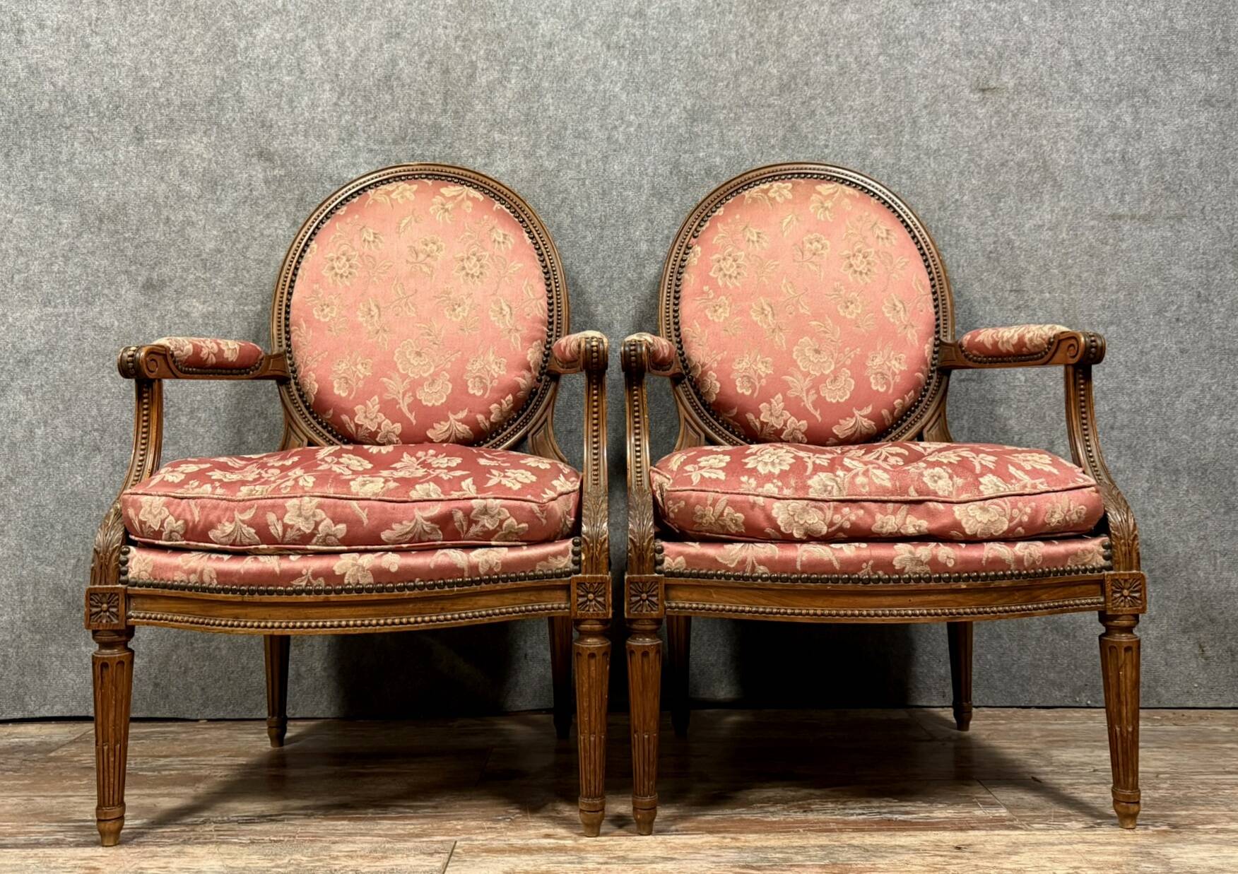 Pair of Louis XVI style armchairs in carved wood circa 1850