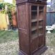 Armoire vintage parisienne à 1 porte vitrée en chêne massif.