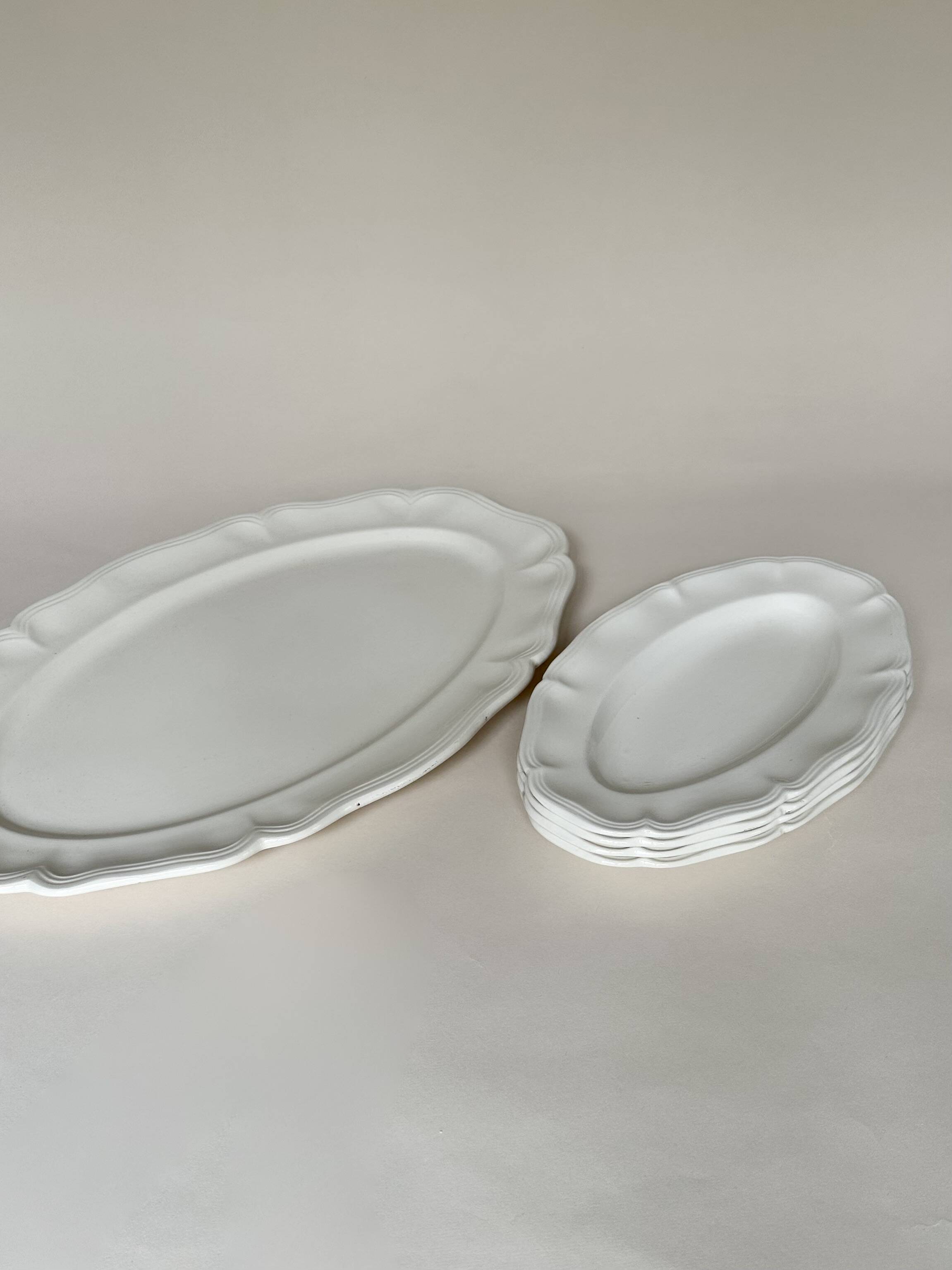 Shaped plates and dishes in Sarreguemines earthenware.