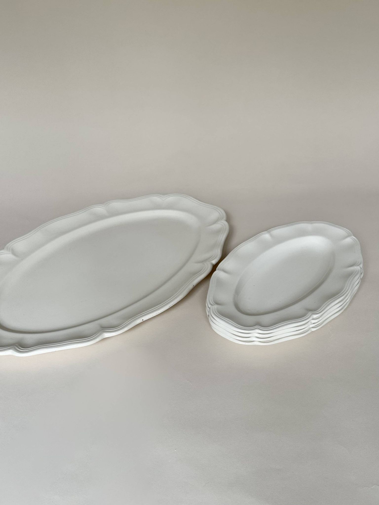 Shaped plates and dishes in Sarreguemines earthenware.