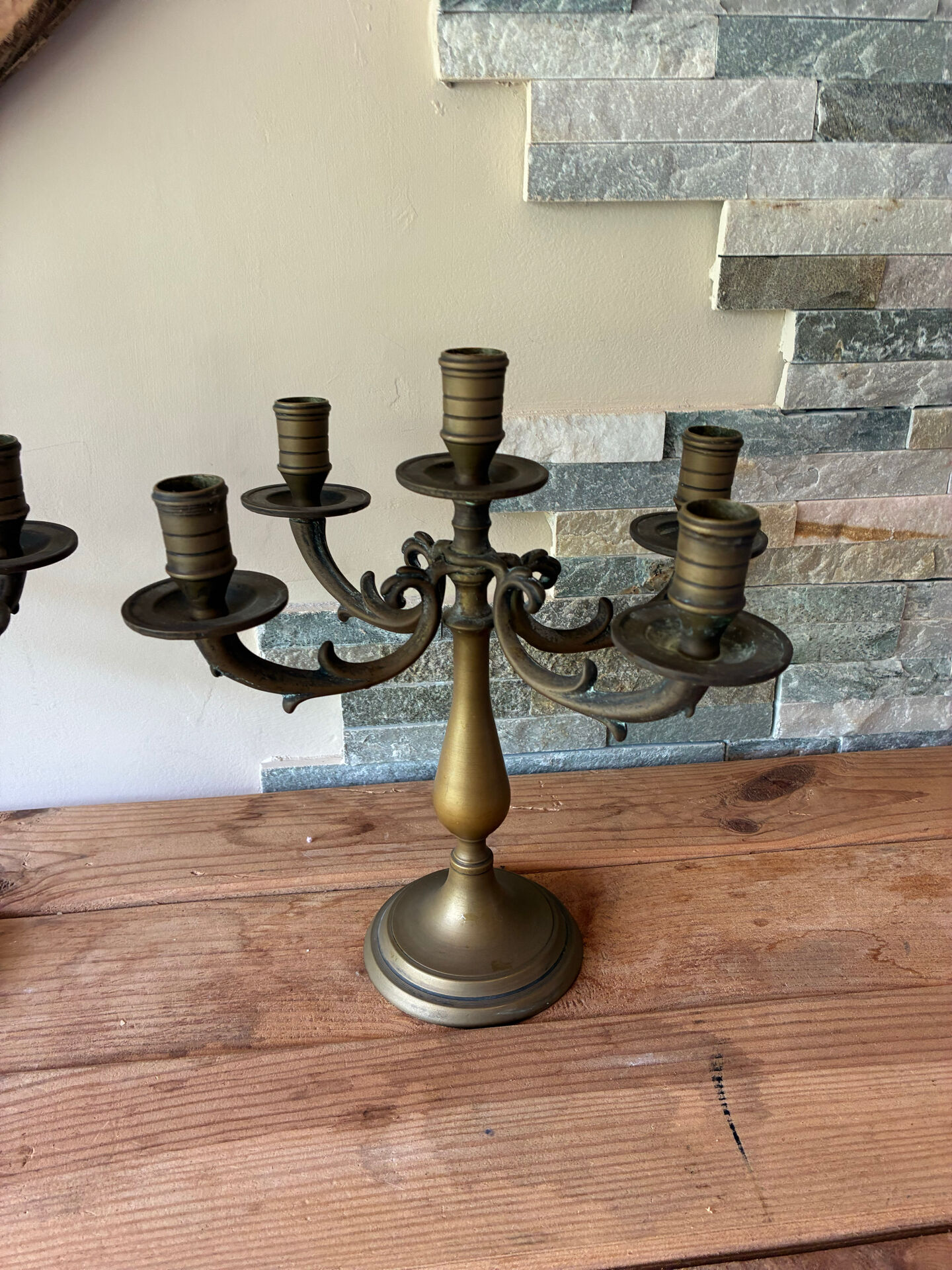 Pair of large 5-light candlesticks in patinated brass, classical style.