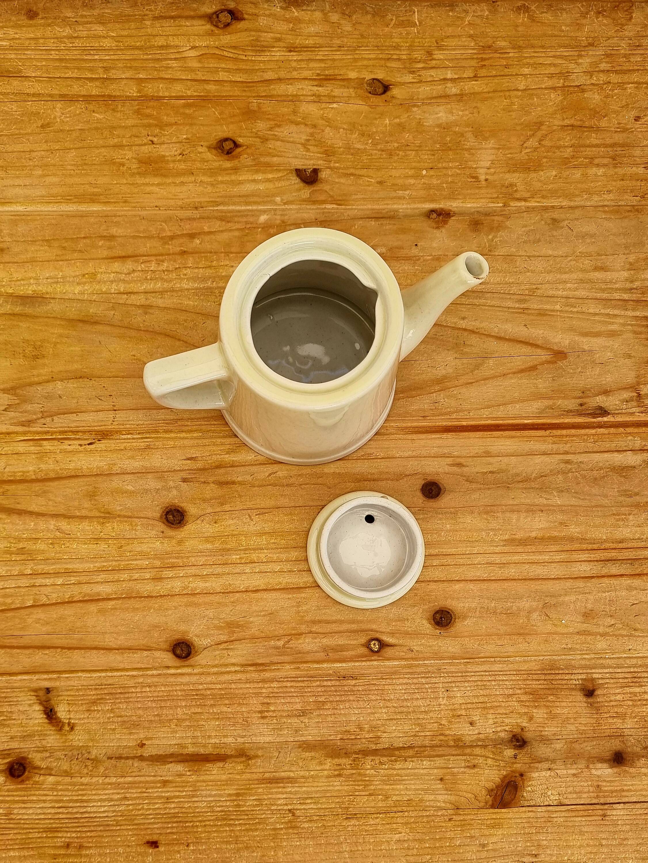 Vintage pastel yellow teapot