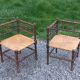 Pair of angled armchairs with turned wood and rush seats from the 1960s.