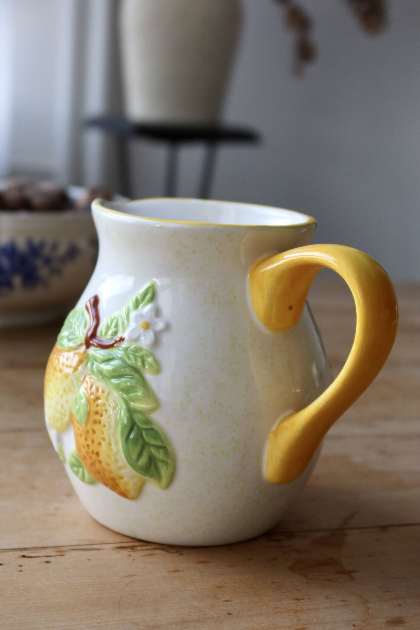Vintage earthenware and slip pitcher with lemon motif