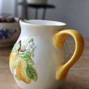 Vintage earthenware and slip pitcher with lemon motif