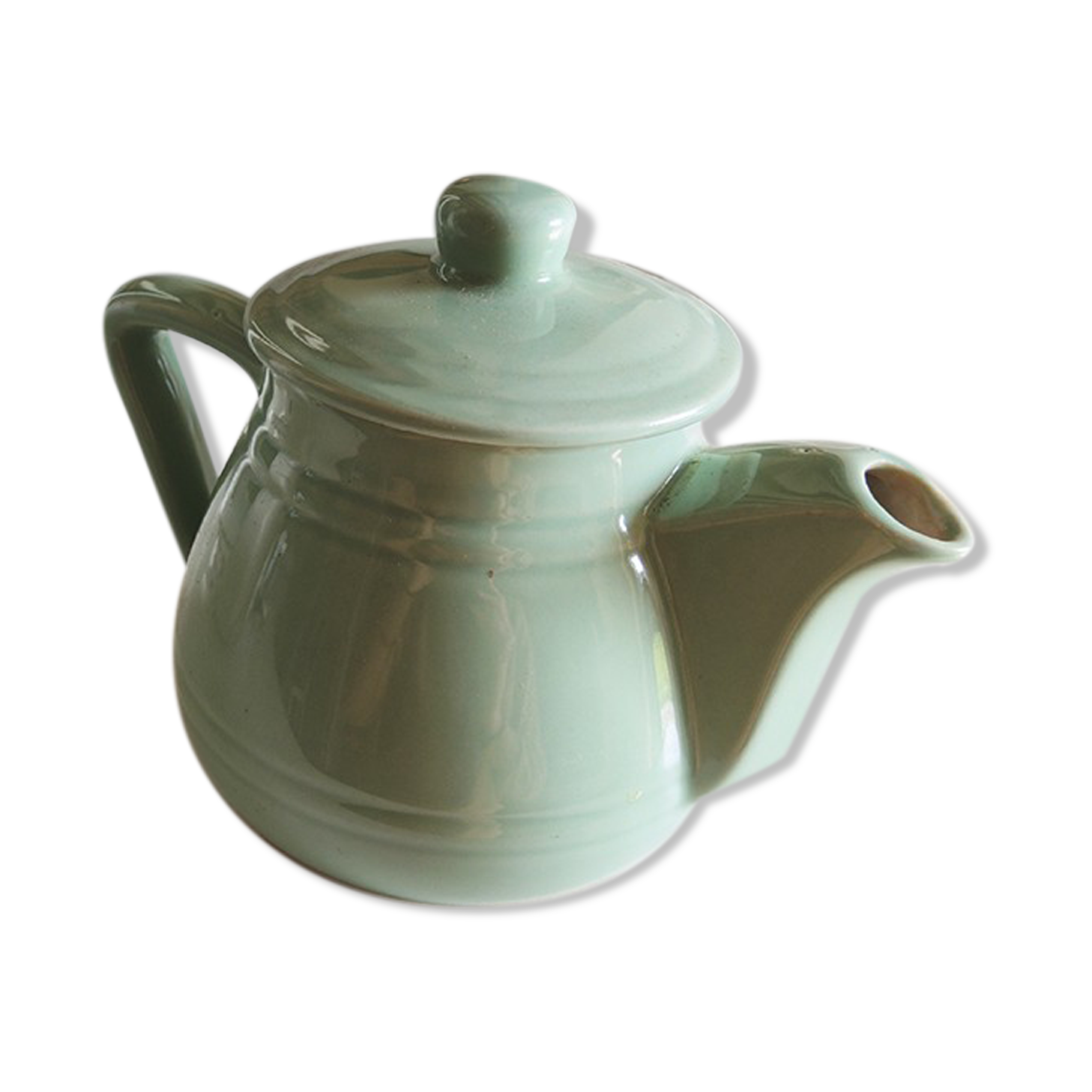 Former art deco teapot in green faïence