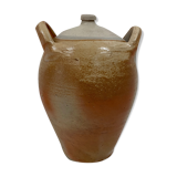 Ancient jar in varnished sandstone