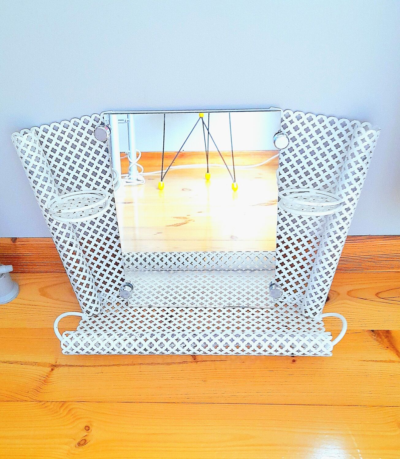 Perforated sheet metal bathroom shelf
