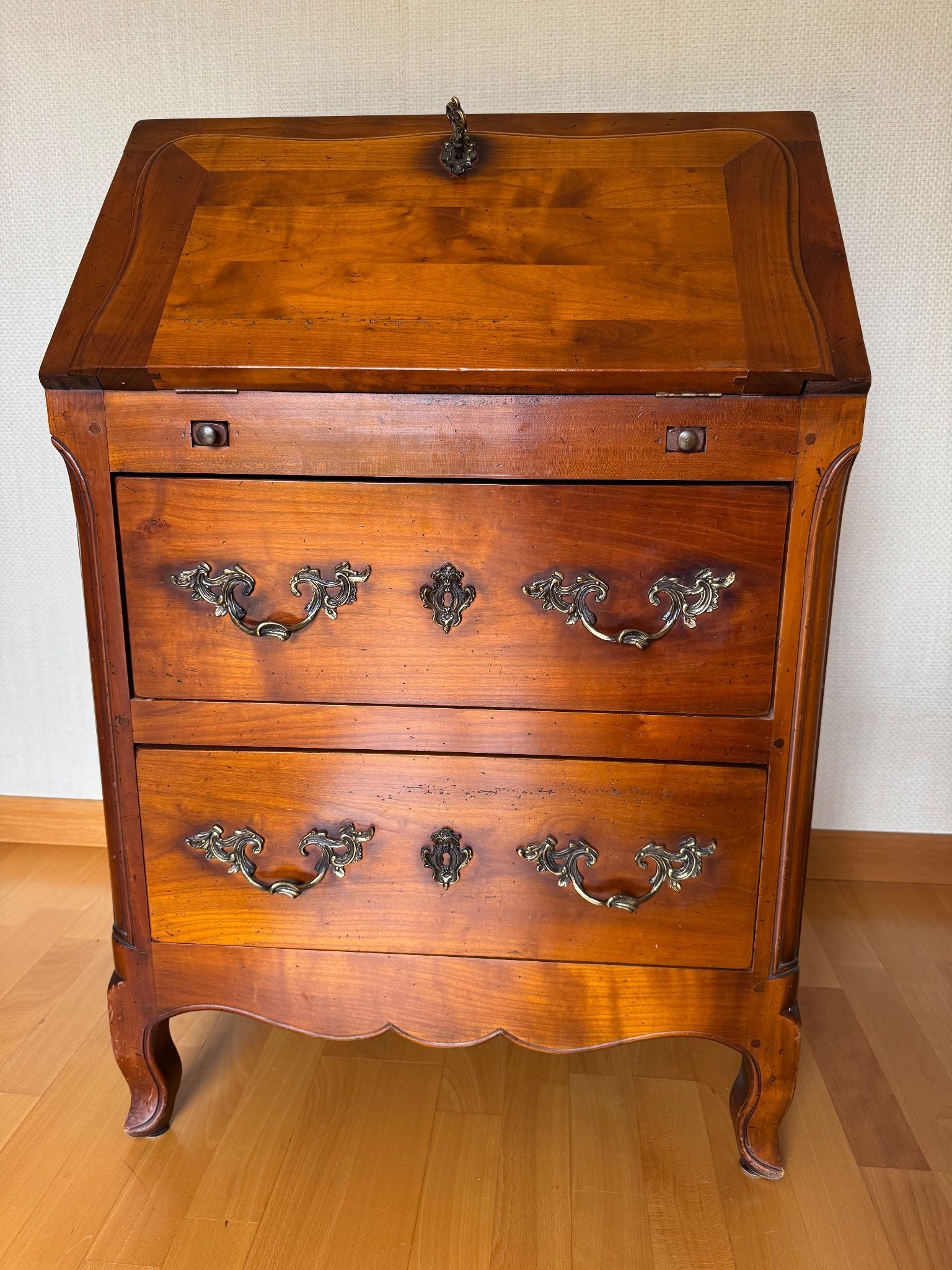 Secretary with drop-down front, signed Jean Laick, master cabinetmaker, cherry wood.
