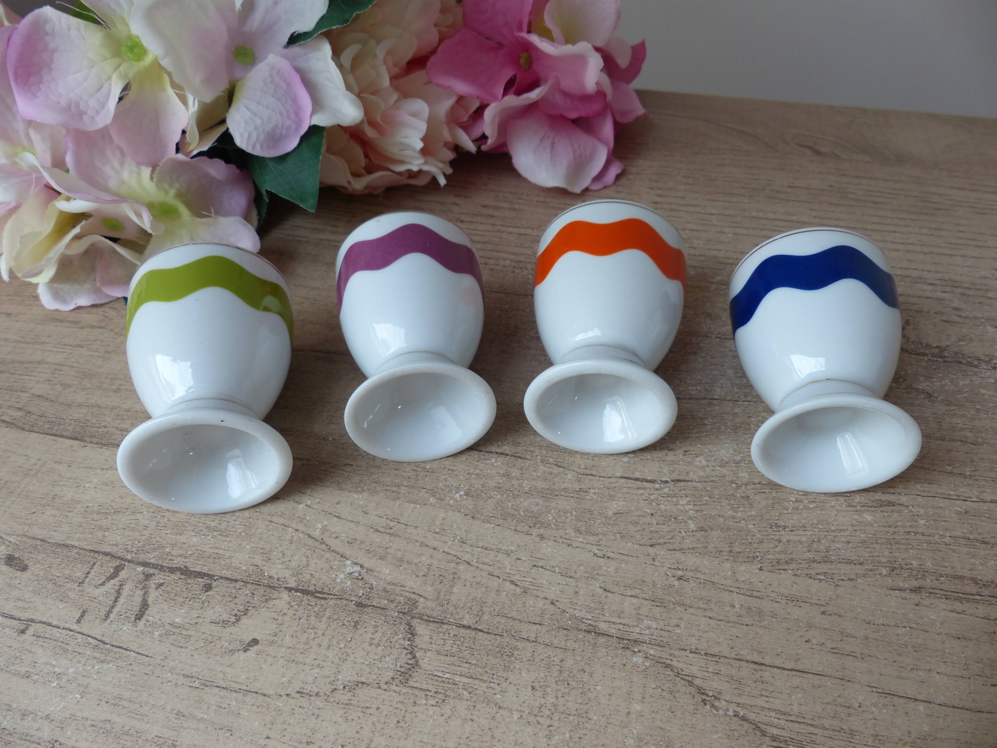 Set of 4 egg cups with spoons, colourful vintage salt and pepper shakers.
