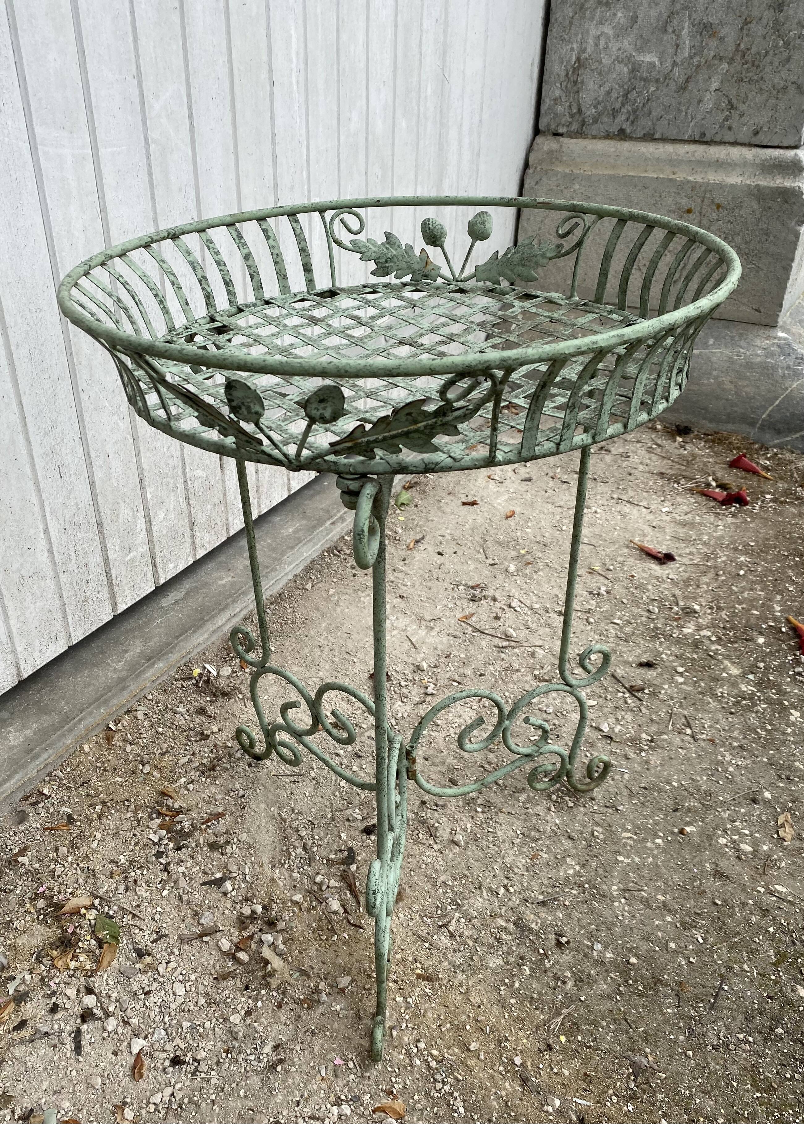 Pedestal cans wrought iron plants