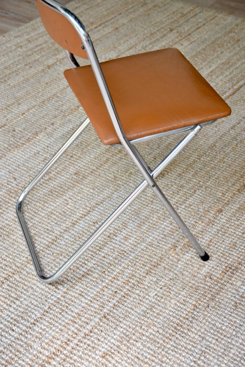Pair of “Soudexvinyl” folding chairs in skai and chrome tube