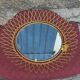 Vintage 1950s sun mirror in gold metal.