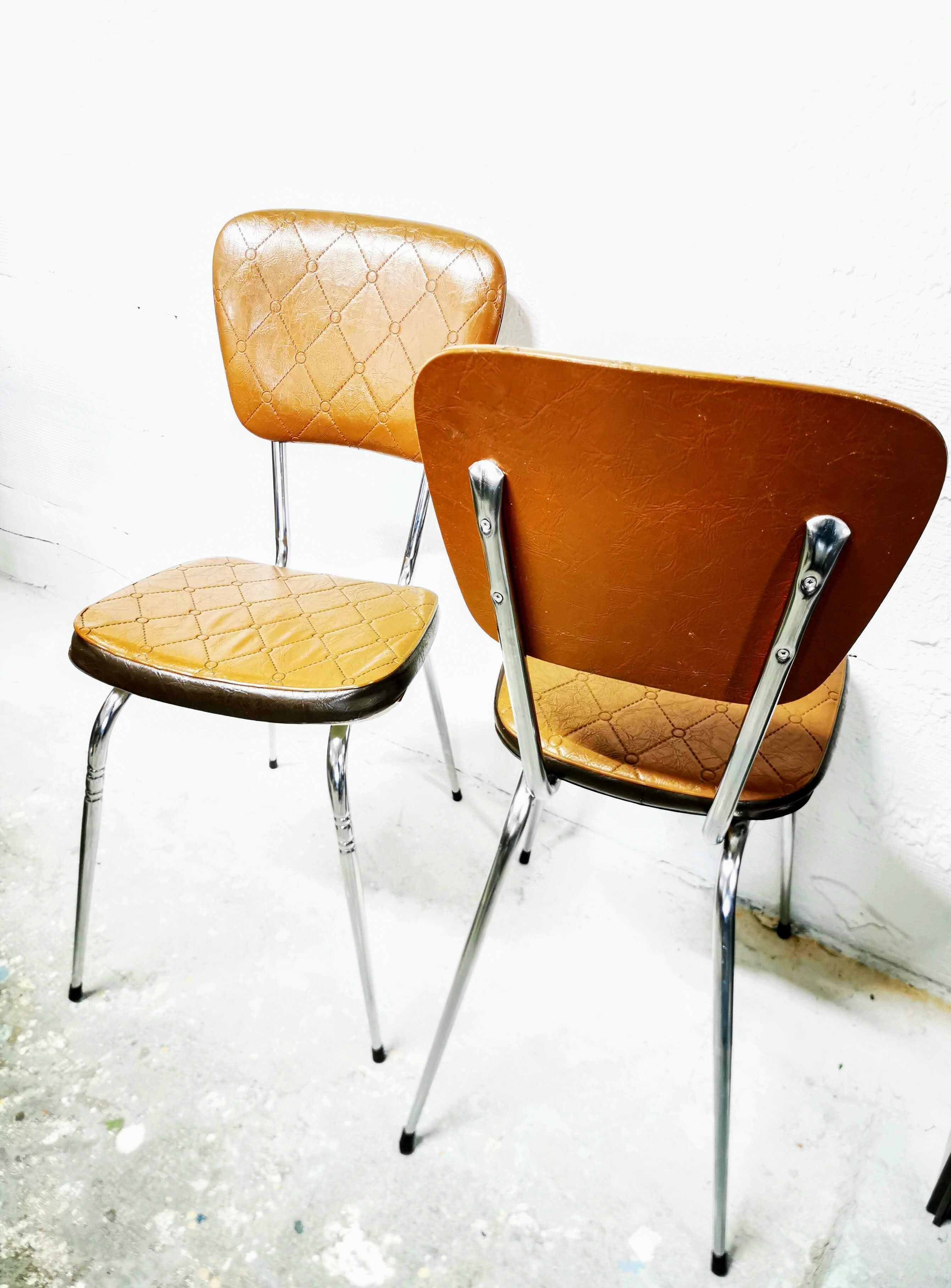 Pair of chrome and skai chairs