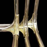 Trio of nesting tables in gold, smoked safety glass, 1970s