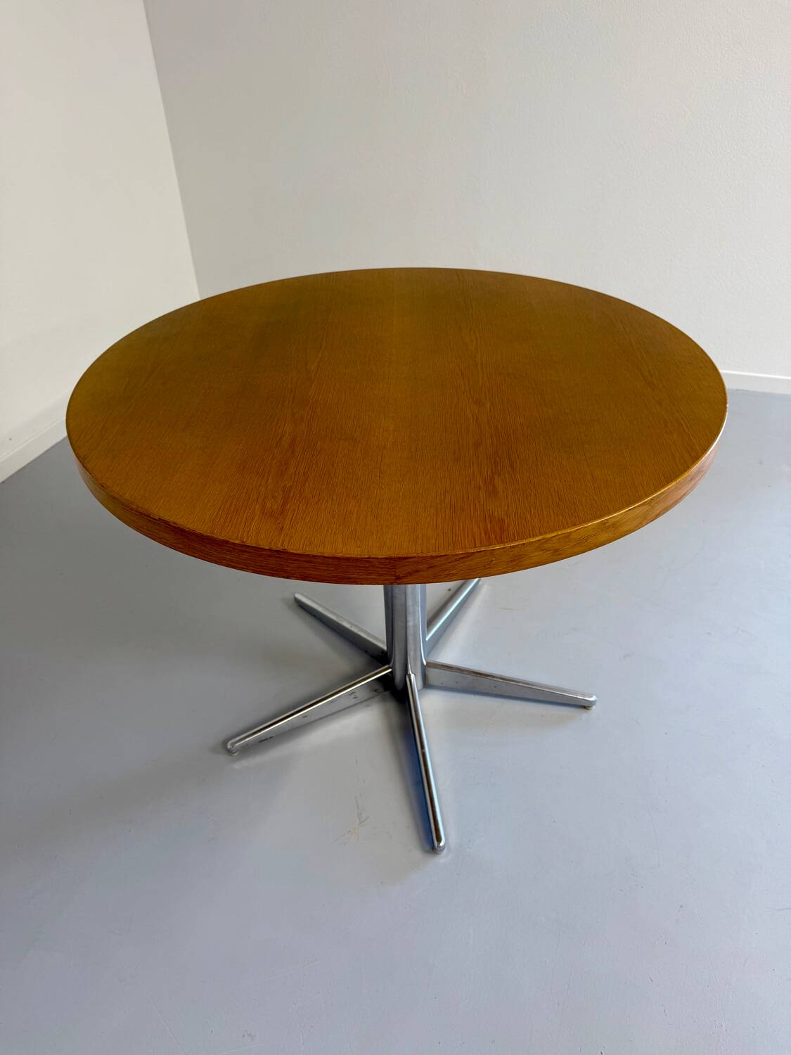 Old round table in solid wood and metal, vintage 70s design