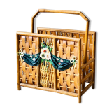 Vintage rattan magazine holder with floral decoration