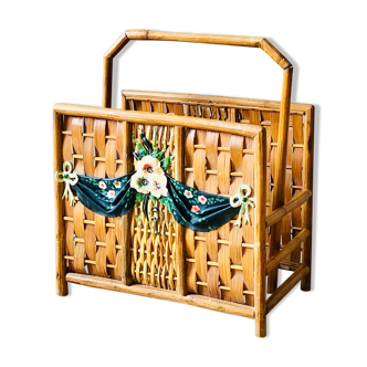 Vintage rattan magazine holder with floral decoration
