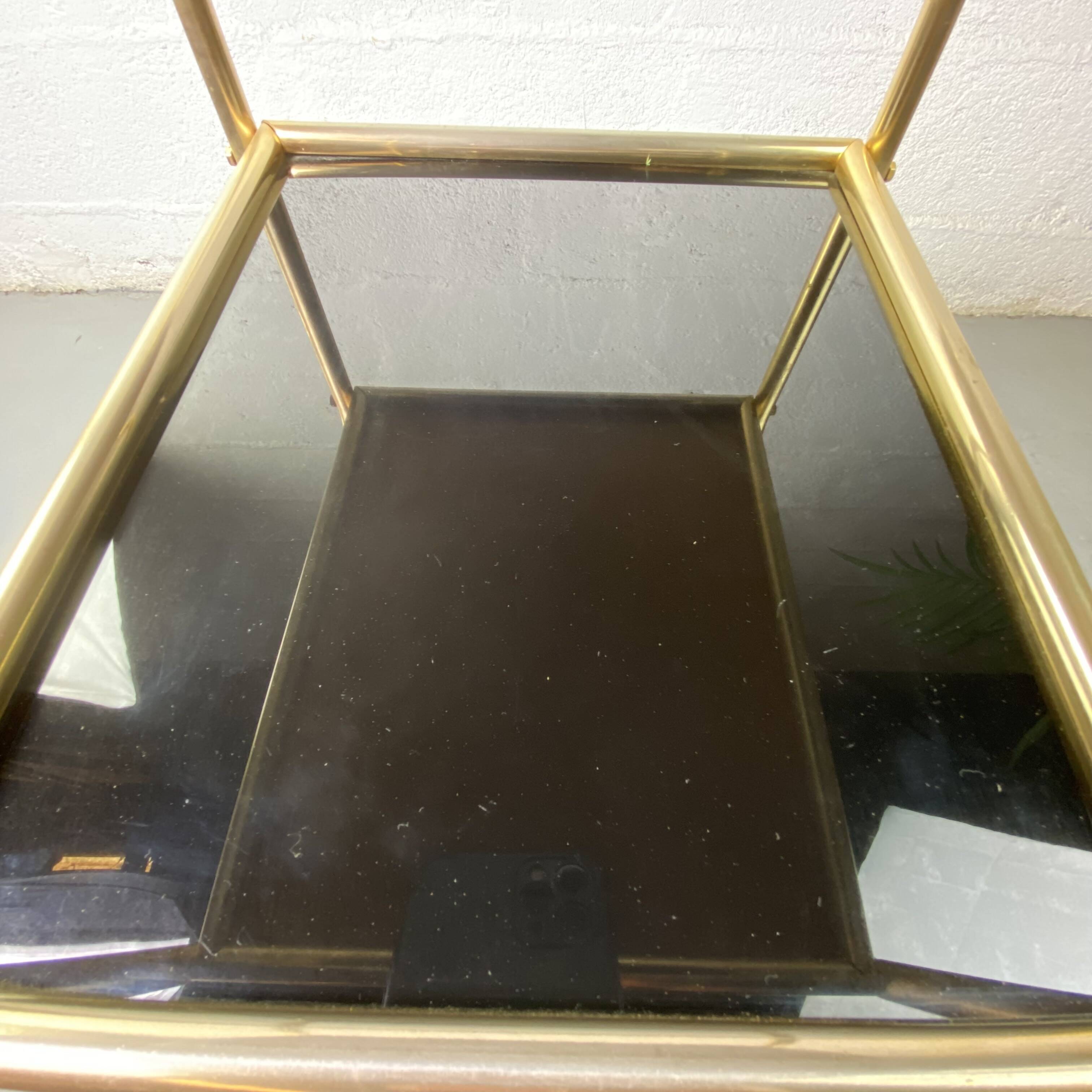 Small rolling trolley in brass and black plastic