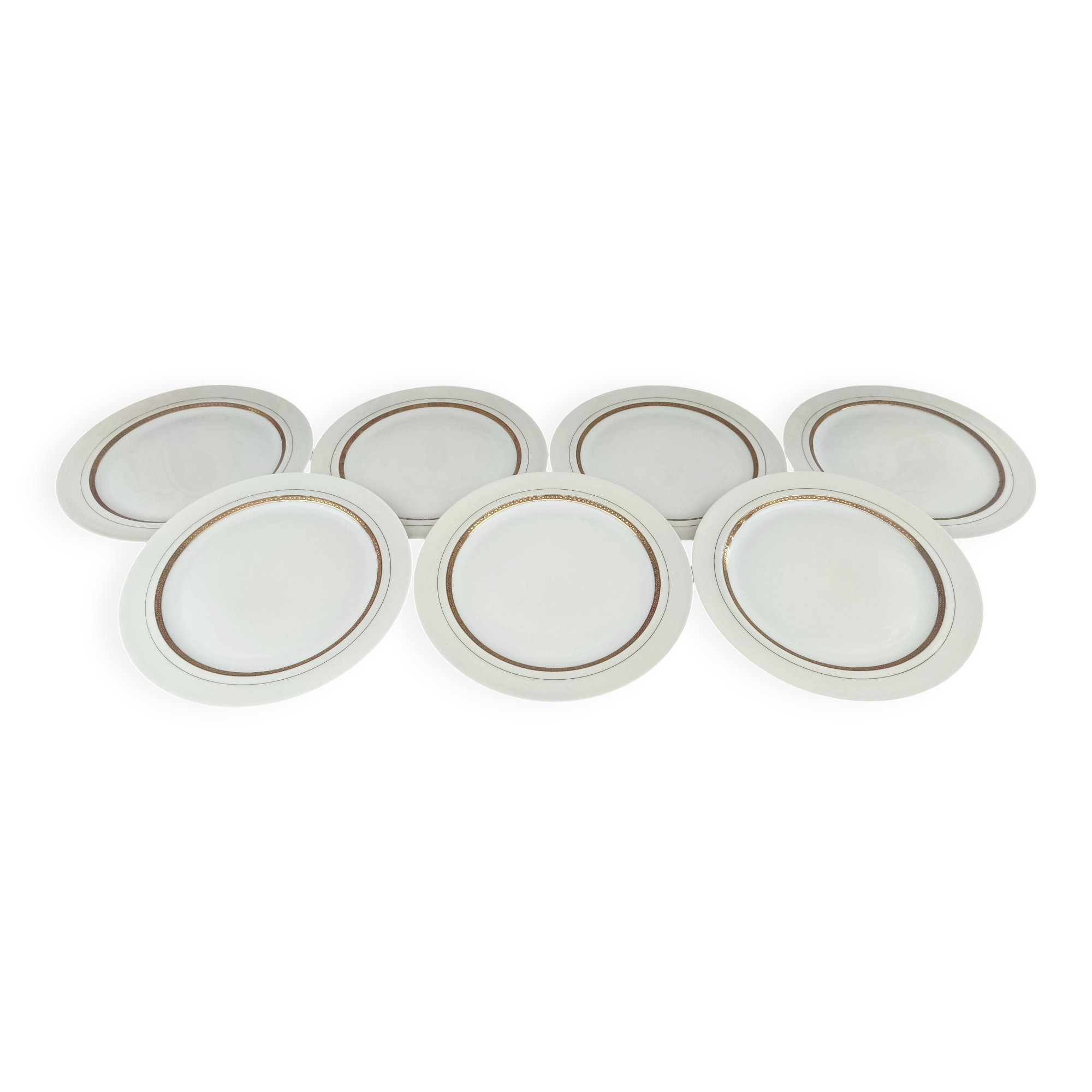 Set of 7 Limoges porcelain dinner plates by A. Vignaud