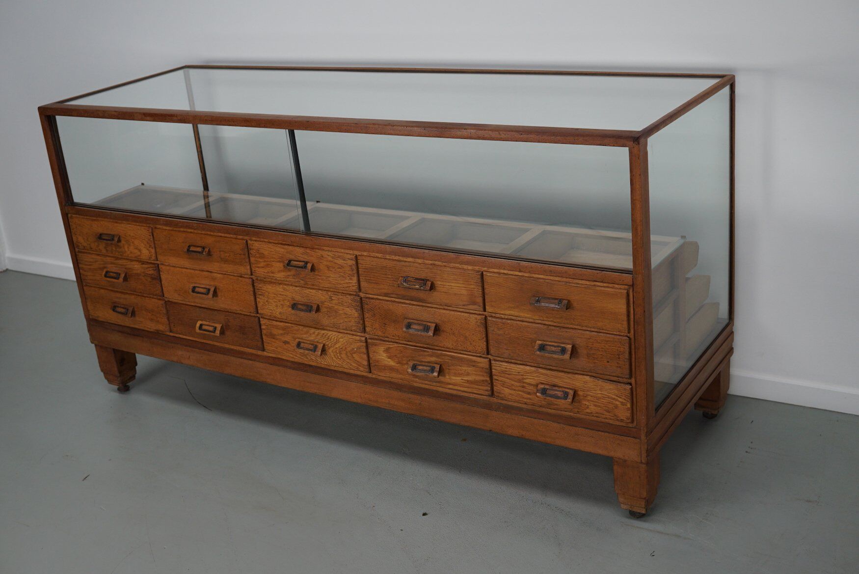 Antique British oak haberdashery cabinet, 1930s