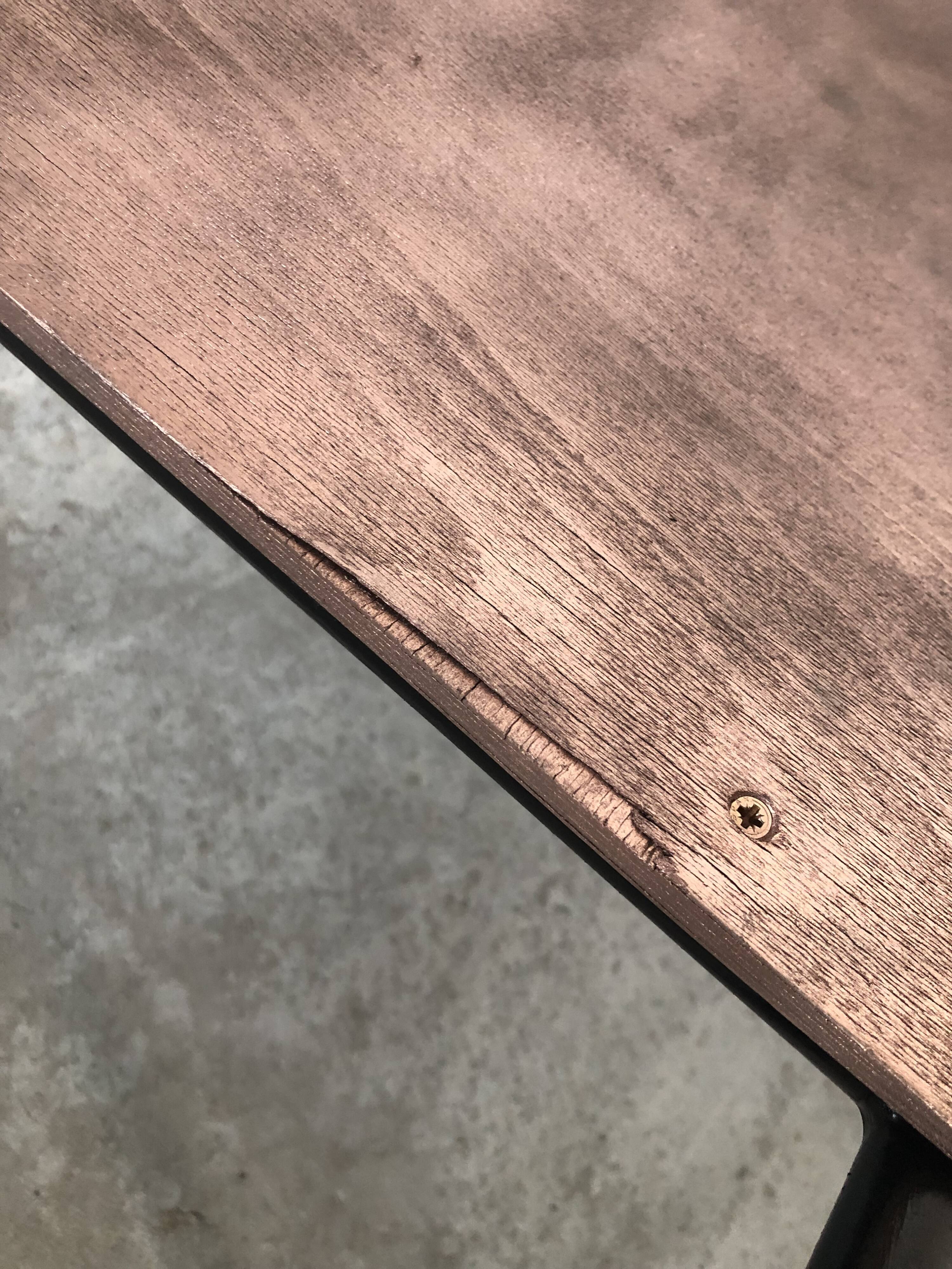 Old chair with armrest restored in metallic pink