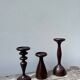 Trio of large turned wooden candlesticks